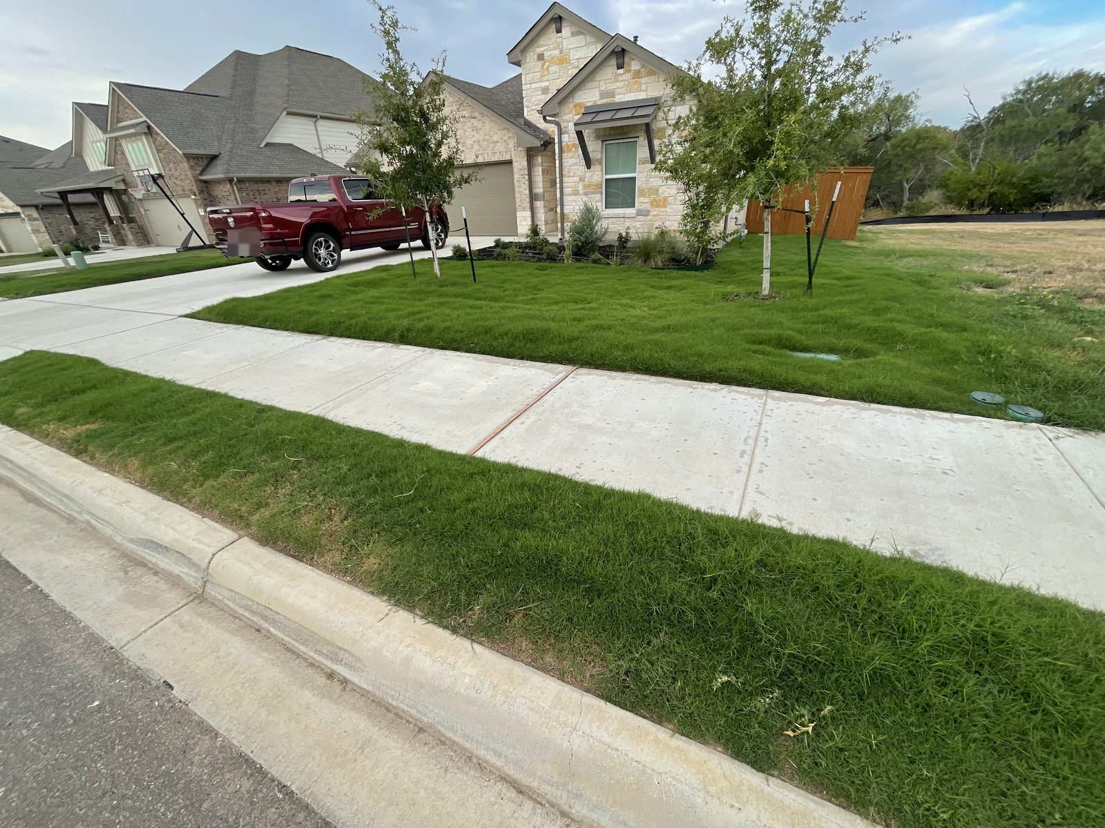 Gonzales Landscaping truck parked in front of a freshly mowed lawn in Cibolo, TX